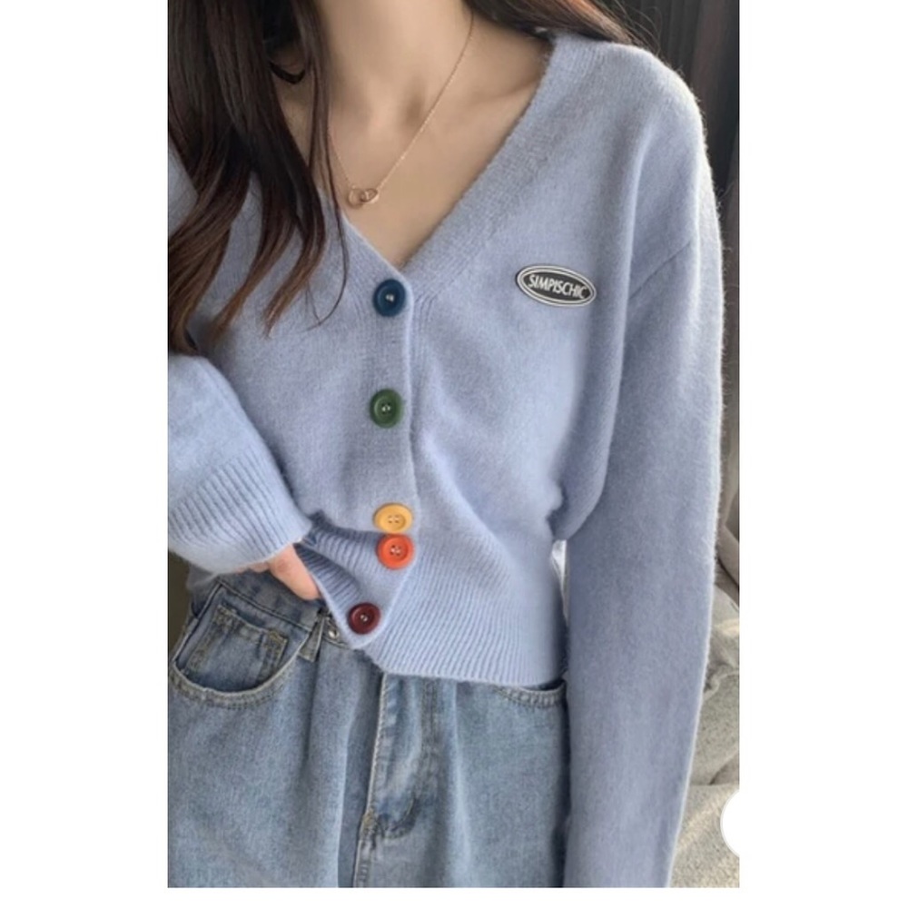 Cardigan sweater with rainbow buttons